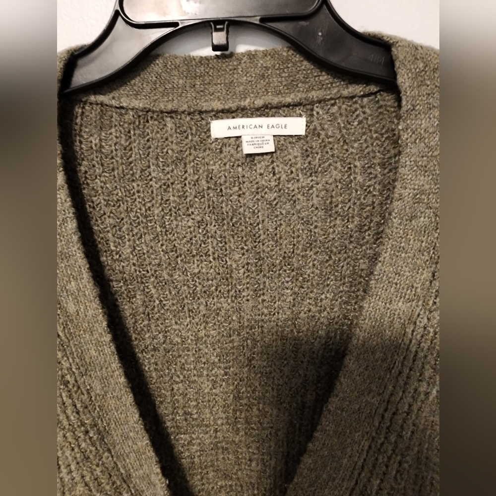 It is a new but without a tag long  army green American Eagle cardigan. Size S.